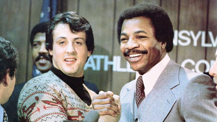 (Sylvester Stallone as Rocky Balboa and Carl Weathers as Apollo Creed in Rocky)